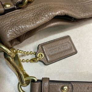 Taupe Coach purse.